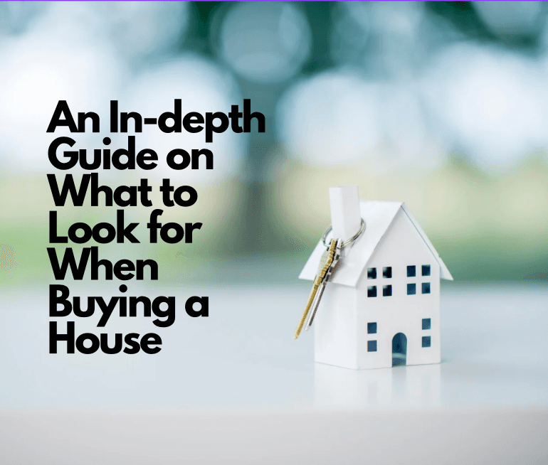 A couple standing in front of a house reviewing paperwork with a real estate agent